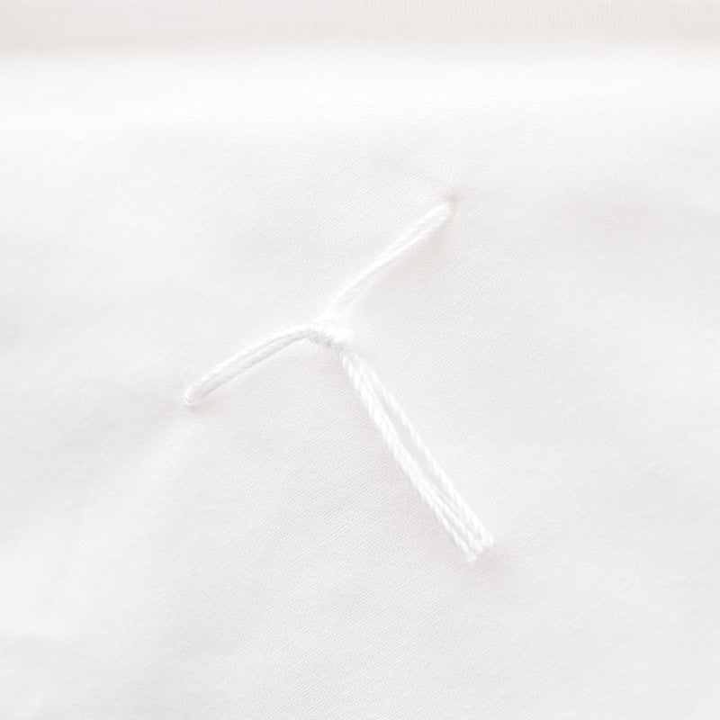 Hand-tied knot to keep the silk filling perfectly in place